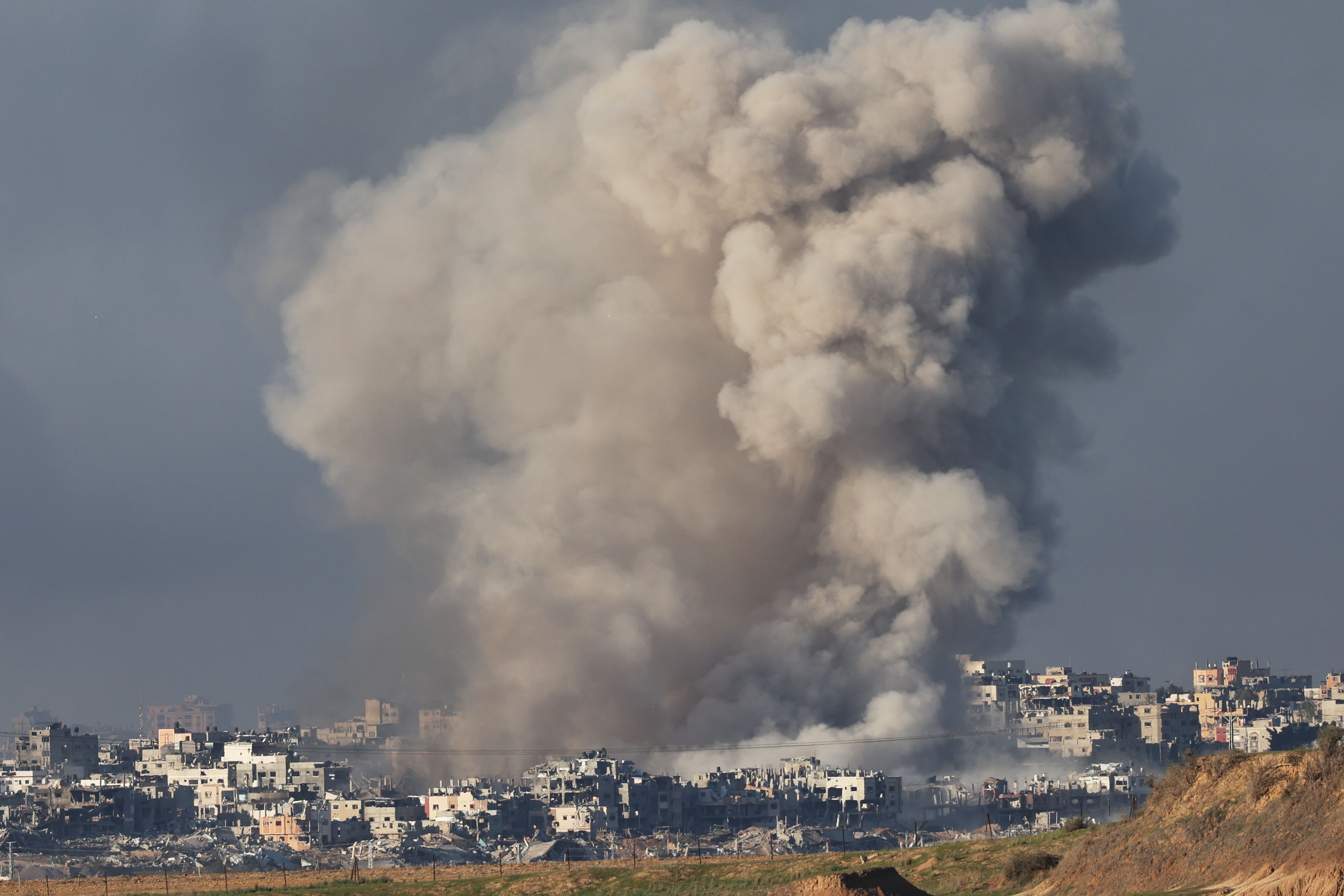 The three Israeli hostages waved a white flag before they were killed by the army