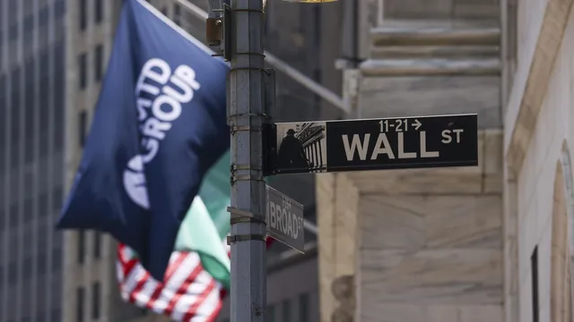 US markets retreat from record highs amid new trade threats